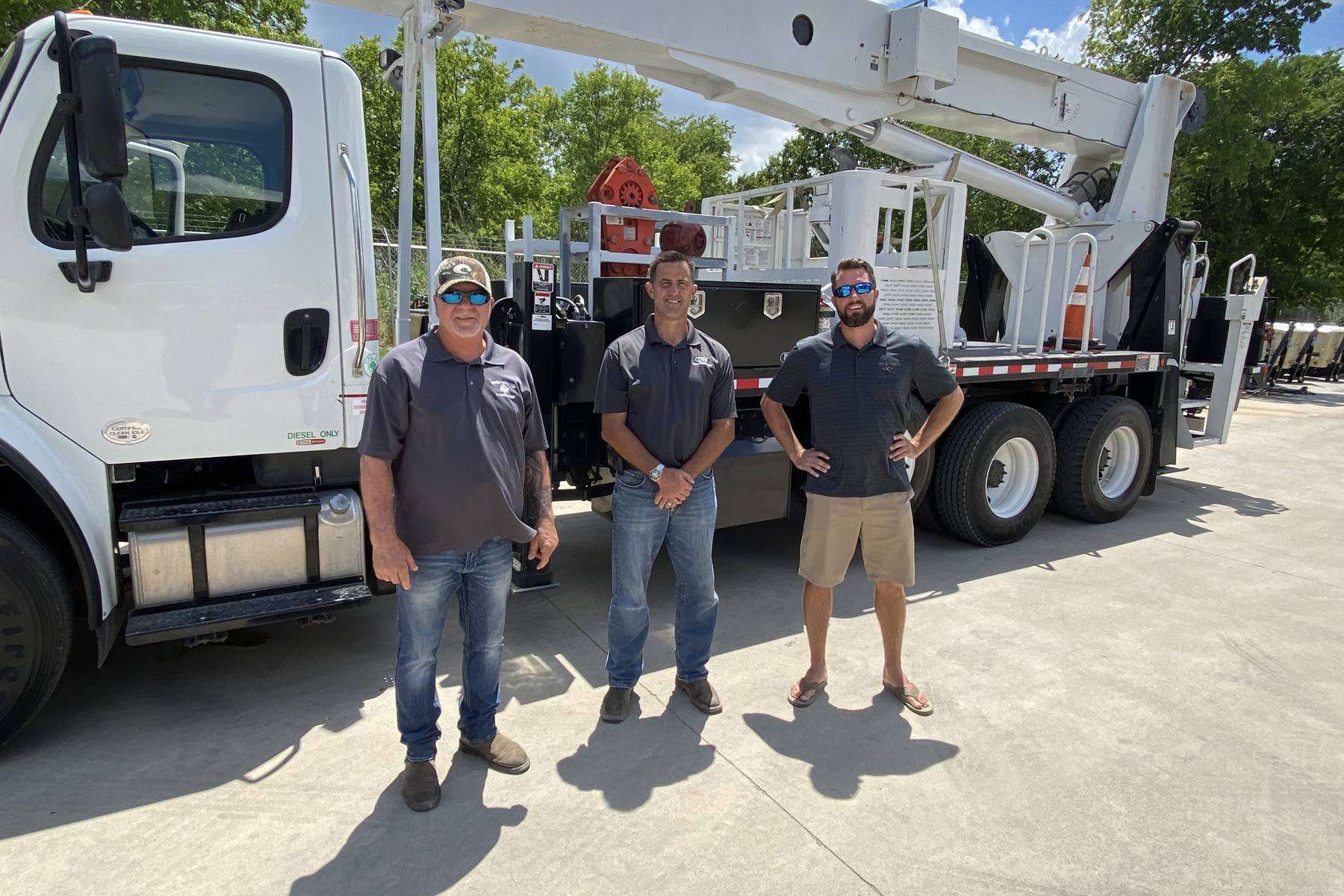 Kenneth Johnston Sr. and Kenneth Johnston Jr. at the Triangle Tree Service yard